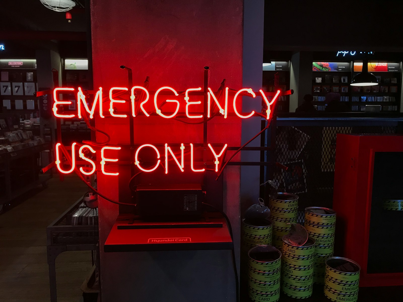 a neon sign that reads emergency use only
